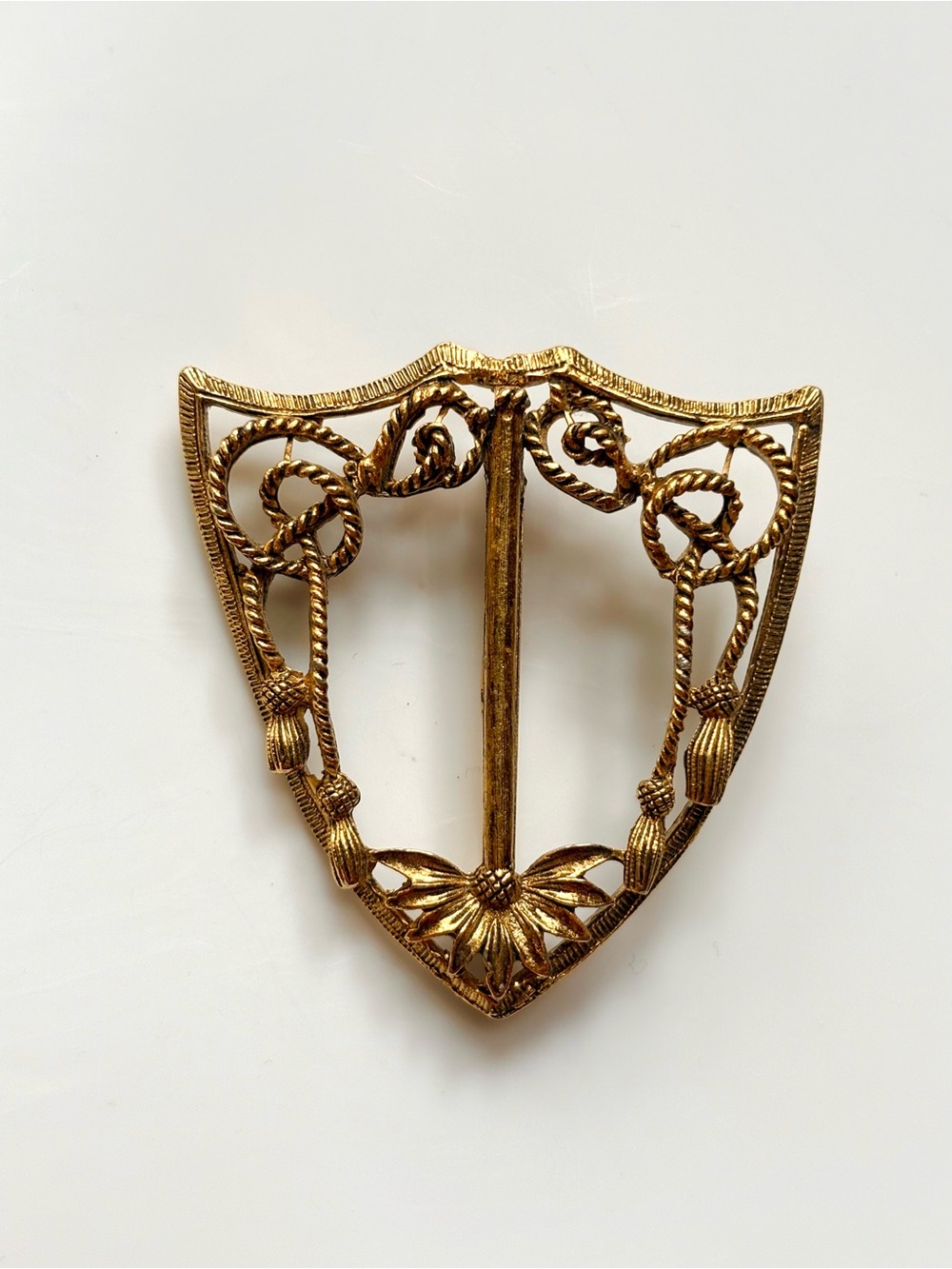 Vintage 1950's gold-toned shield-shaped brooch